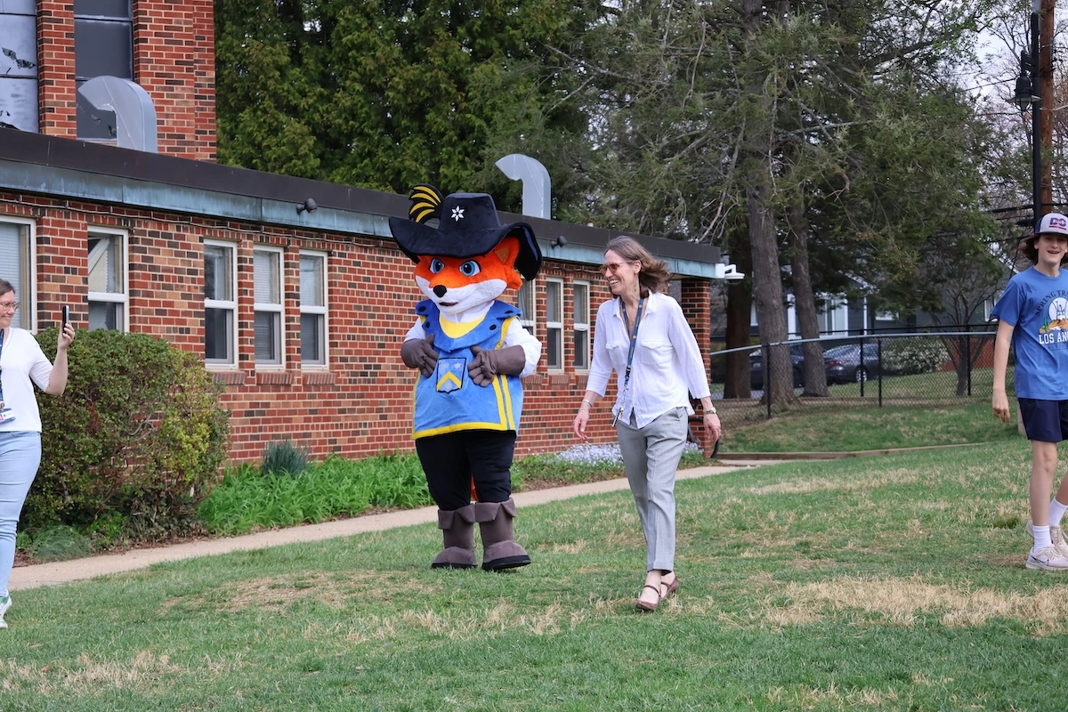 Rochembeau mascot with students and staff
