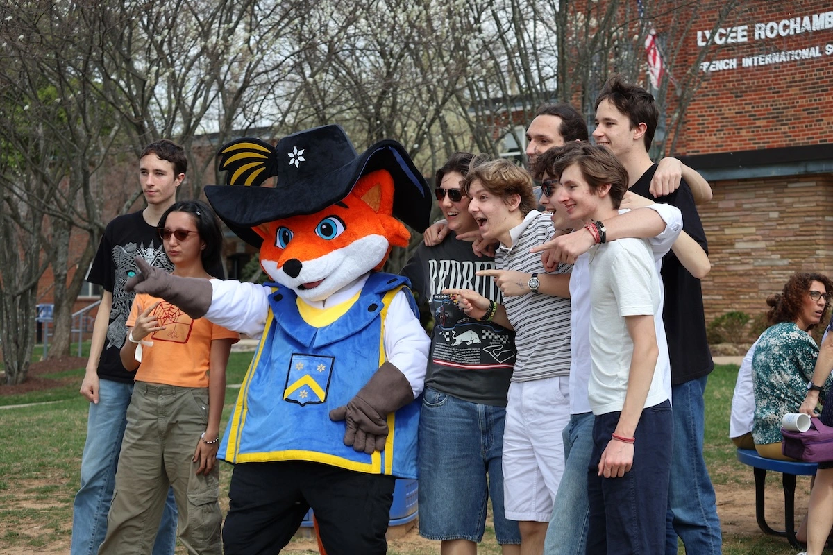 Rochembeau mascot engaging with audience