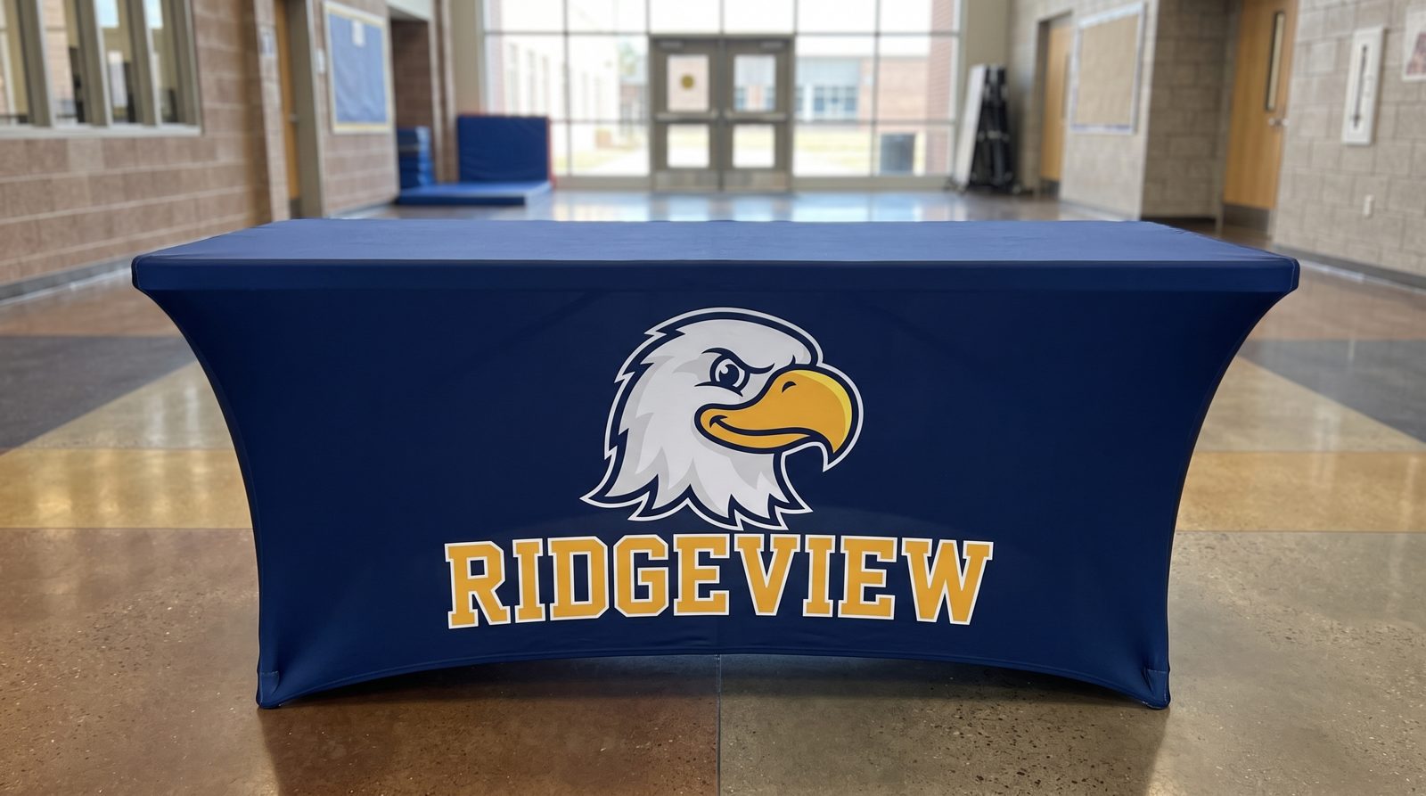 Fitted navy table cover with an eagle mascot