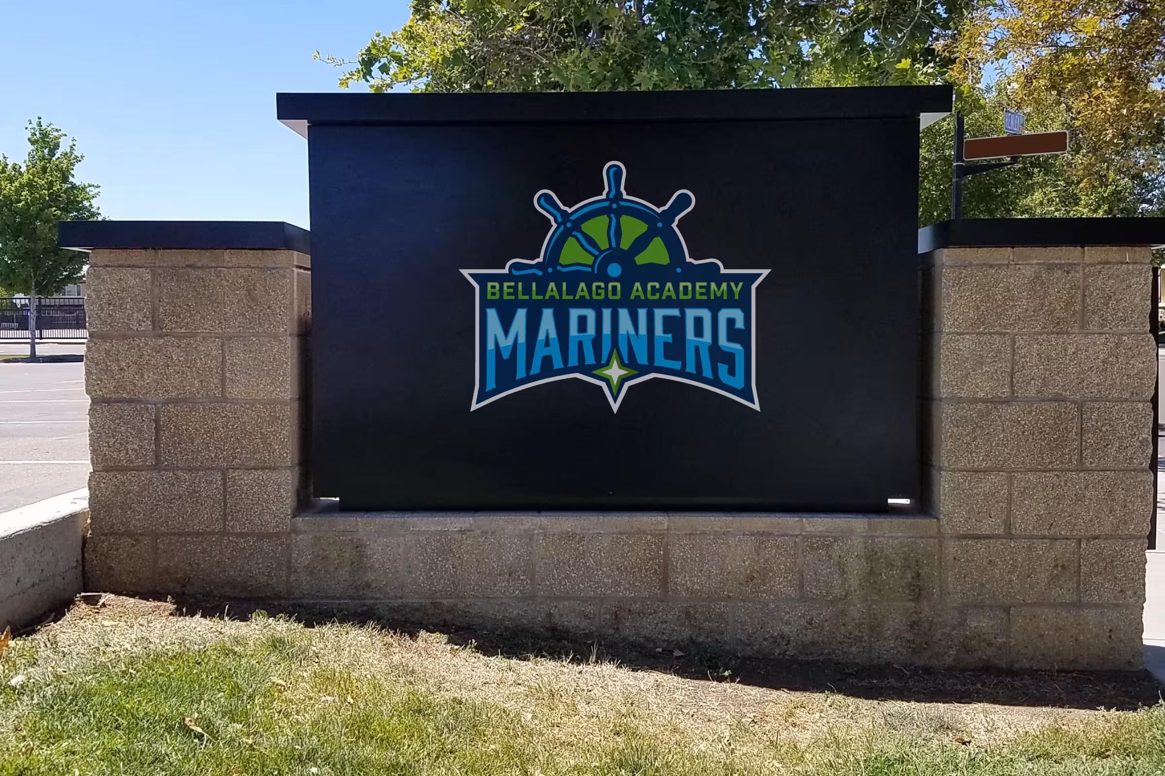 Monument sign with Mariners badge—high‑contrast black panel for drive‑by visibility