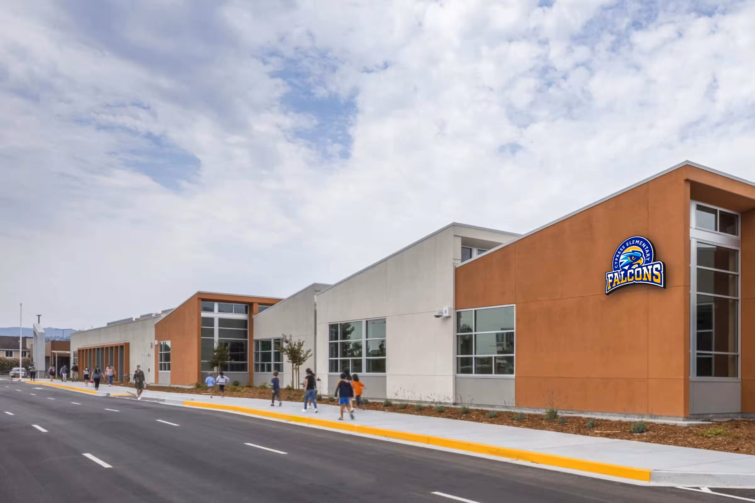 Exterior campus elevation with Falcons badge applied to facade—architectural identification for curb appeal and wayfinding