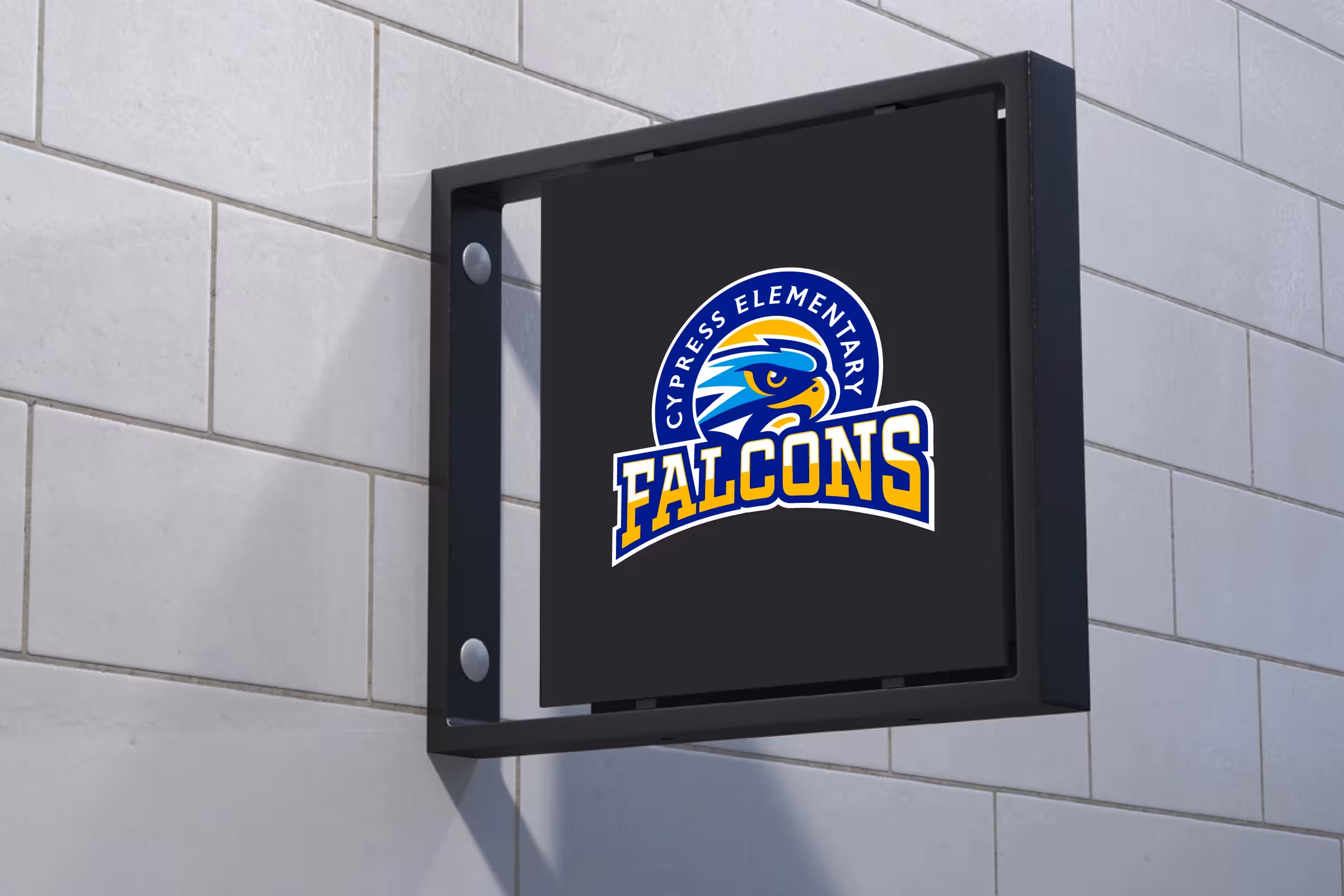Interior blade sign—compact Falcons badge on dark panel mounted to tile wall for corridors and reception areas