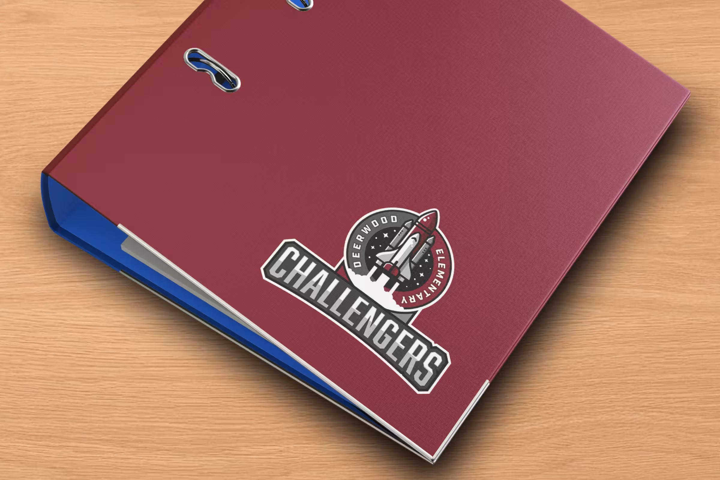 Burgundy ring binder with Challengers crest decal—administrative stationery application