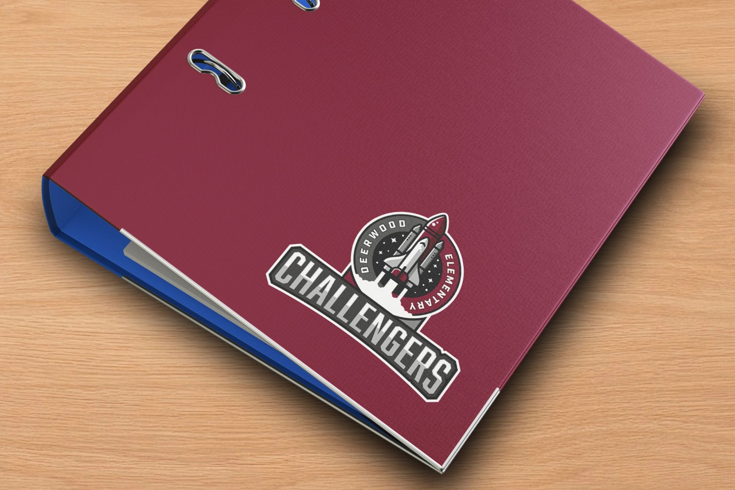 Burgundy ring binder with Challengers crest decal—administrative stationery application