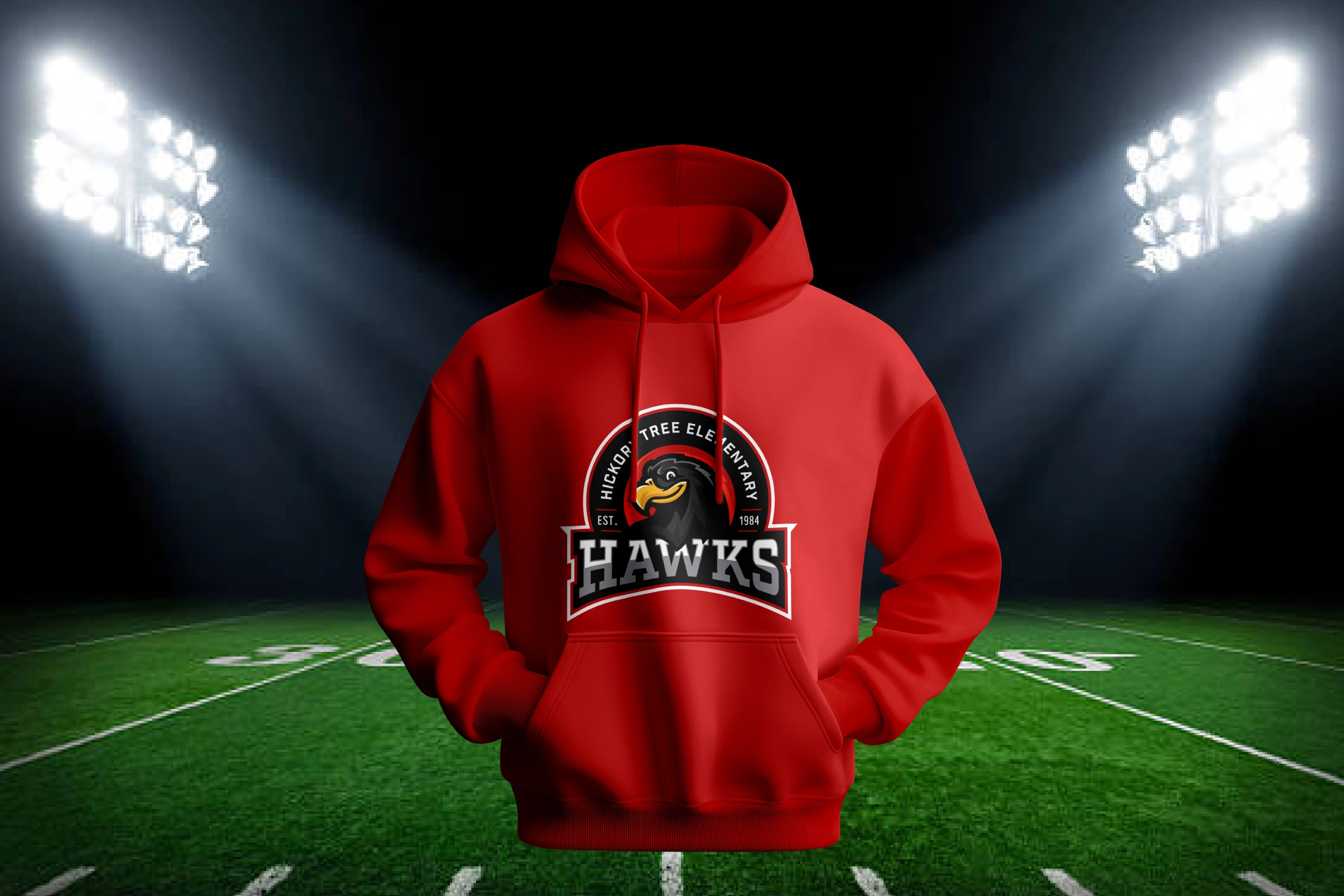 Red hoodie with Hickory Tree Hawks crest—game‑night spirit wear presentation