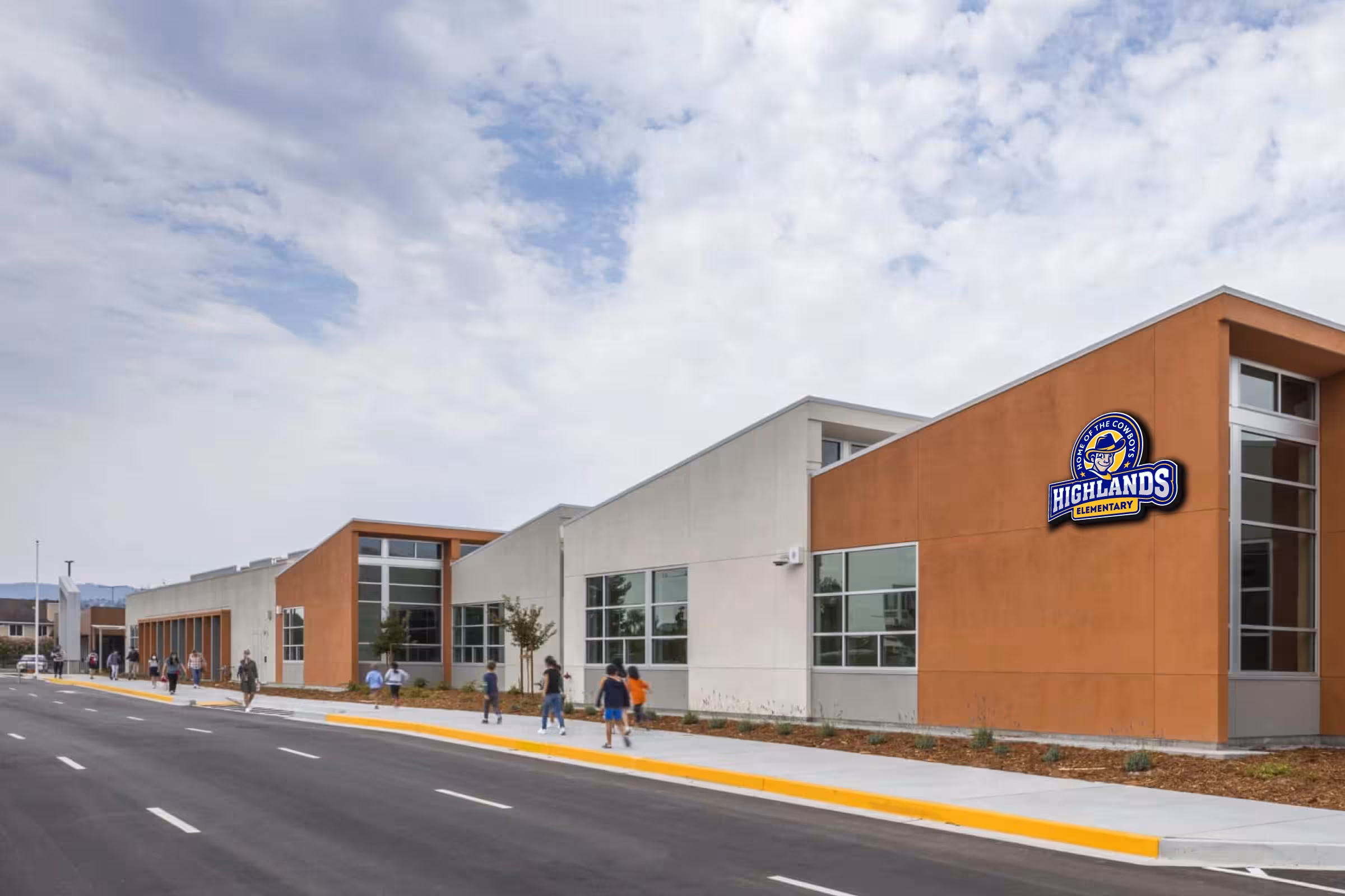 Campus facade with Cowboys crest—architectural identification on brick elevation