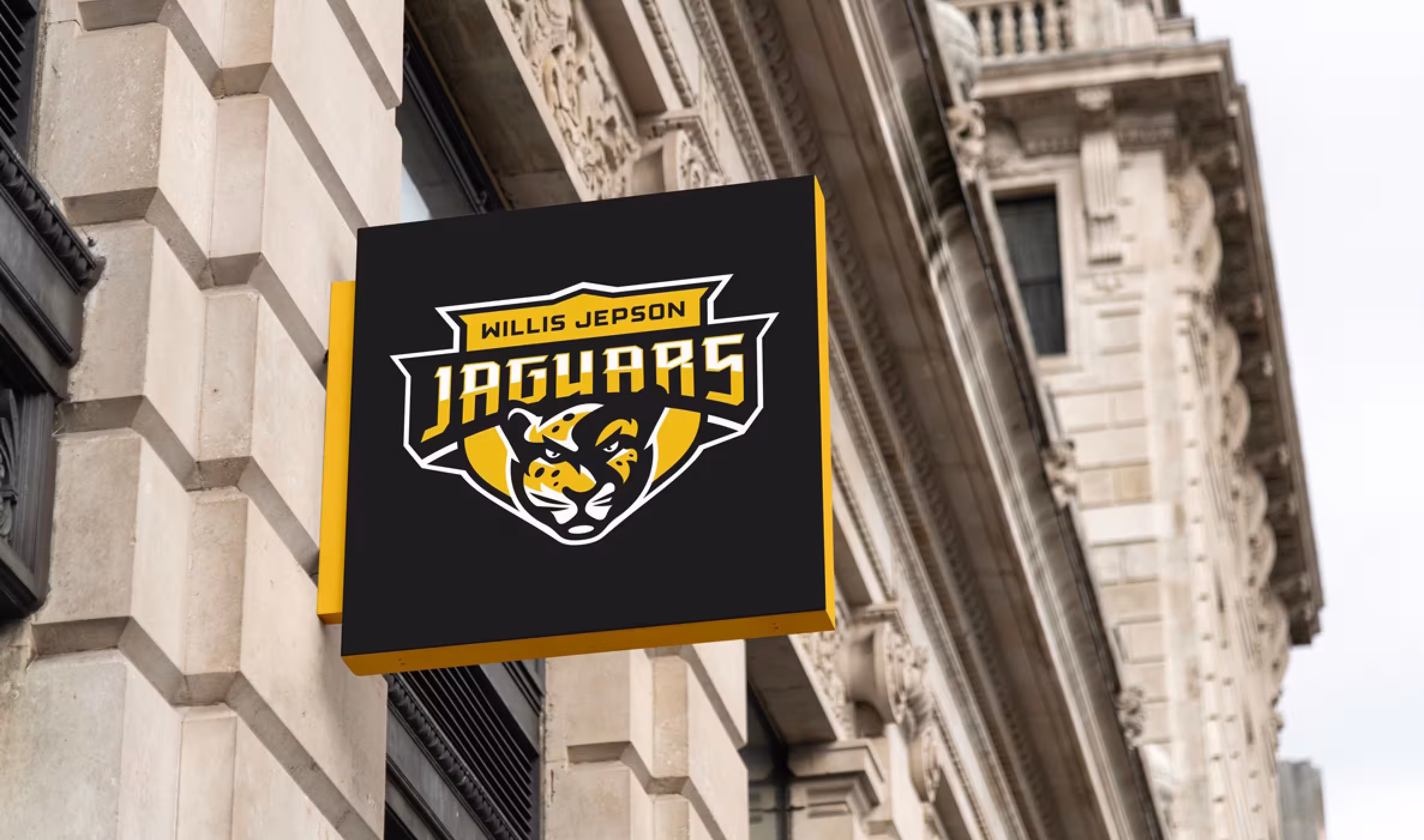 Environmental graphics: banners, rail wraps and wall graphics applying the claw-mark pattern and crest around campus