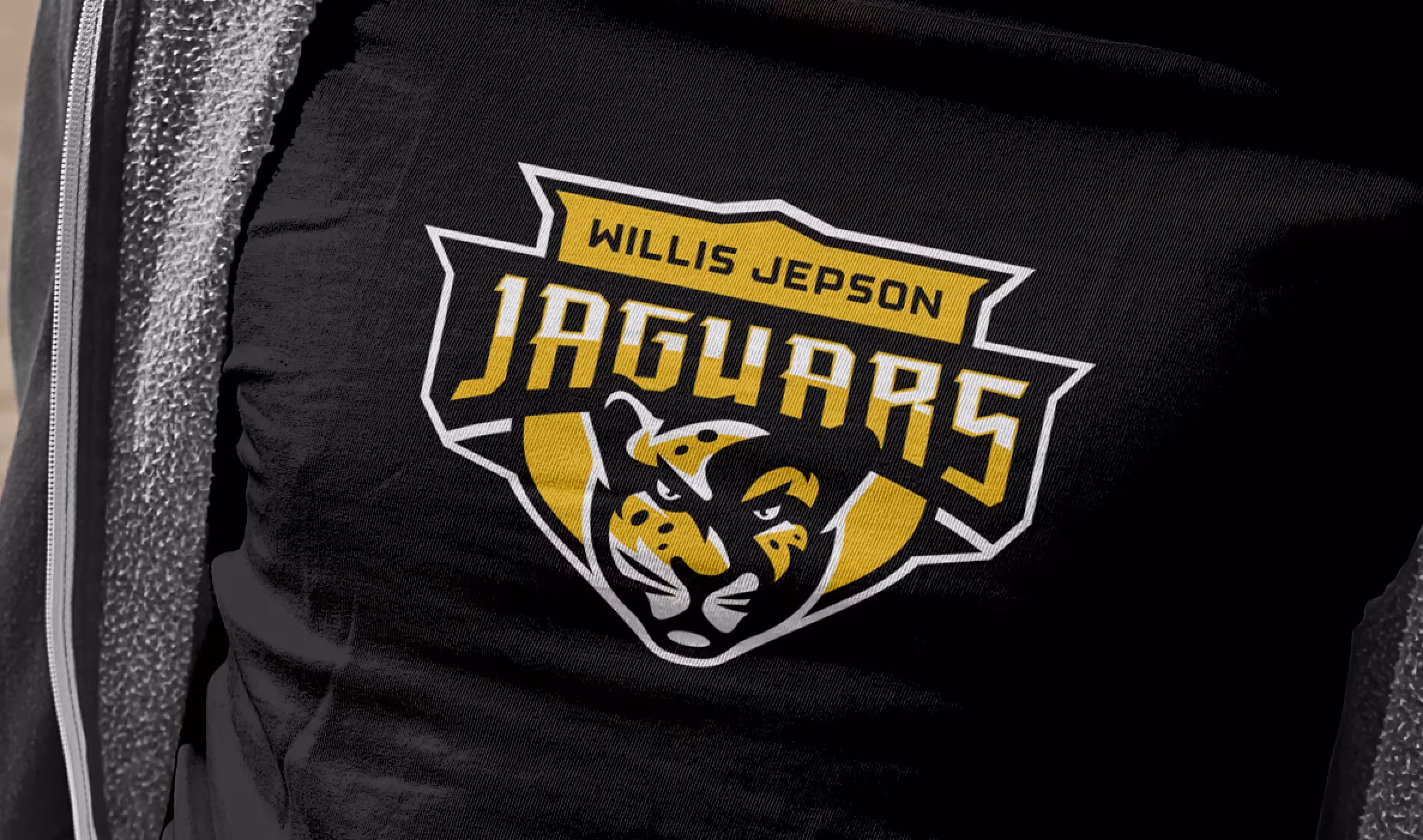 Brand identity hero on gold field—clean presentation of the core crest for signage, print and digital headers